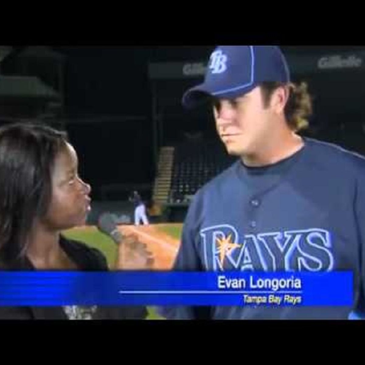 Evan longoria catches a ball during interview