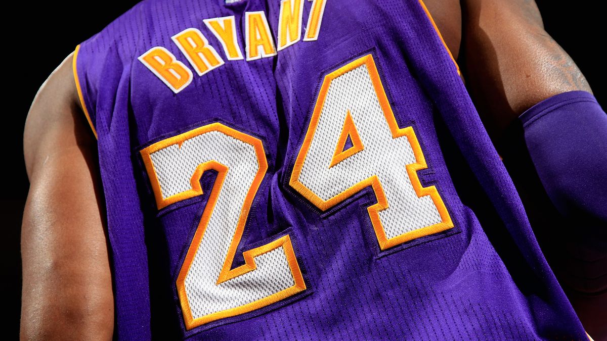 Here is a pic of Kobe wearing his dad's jersey. RIP to a real one