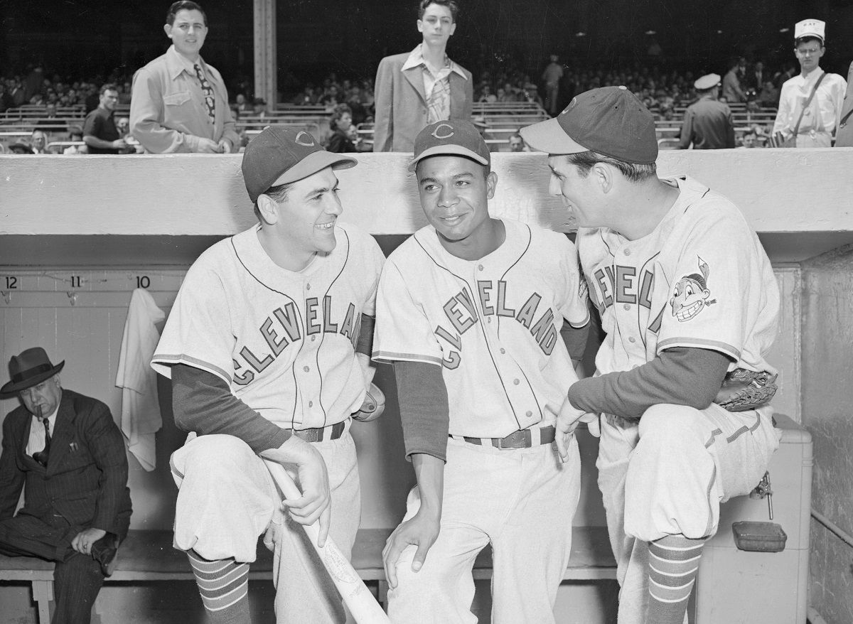 Photo shows from left to right Lou Boudreau, manager of the Cleveland Indians; Larry Doby and Hank Greenberg. (Getty Images)