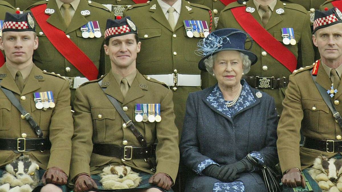 HOWE BARRACKS, ENGLAND - NOVEMBER 9: (NO UK SALES FOR 28 DAYS) HRH Queen Elizabeth II poses at Howe Barracks in Canterbury, Kent with the 1st Battalion of The Argyll and Sutherland Highlanders were she presented them with the Wilkinson Sword of Peace for establishing good relations with communities during their service in Iraq, November 9, 2004 in Kent, England. The Queen also presented soldiers with Operational Service Medals for their service and was expected to meet some of the families of those currently serving with the battalion. (Photo by ROTA/Getty Images) (ROTA/Getty Images)