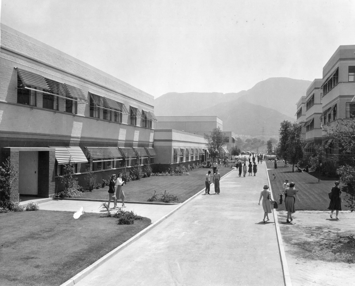 View along Minnie Mouse Boulevard on the Disney Studios lot, Burbank, California, 1943. Among the visible buildings are the Inking and Painting, Production Camera, and Cutting departments (left), the Animation Building shown (right), and the Publicity and Live-Action Buildings (rear). (Photo by Office of War Information/PhotoQuest/Getty Images) (Office of War Information/PhotoQuest/Getty Images)