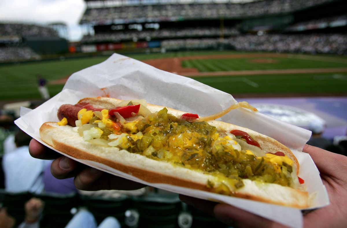 DENVER - APRIL 02:  A fan has a loaded hotdog at the ready to celebrate Opening Day as the Arizona Diamondbacks face off against the Colorado Rockies on April 2, 2007 at Coors Field in Denver, Colorado.  (Photo by Doug Pensinger/Getty Images) (Doug Pensinger/Getty Images)