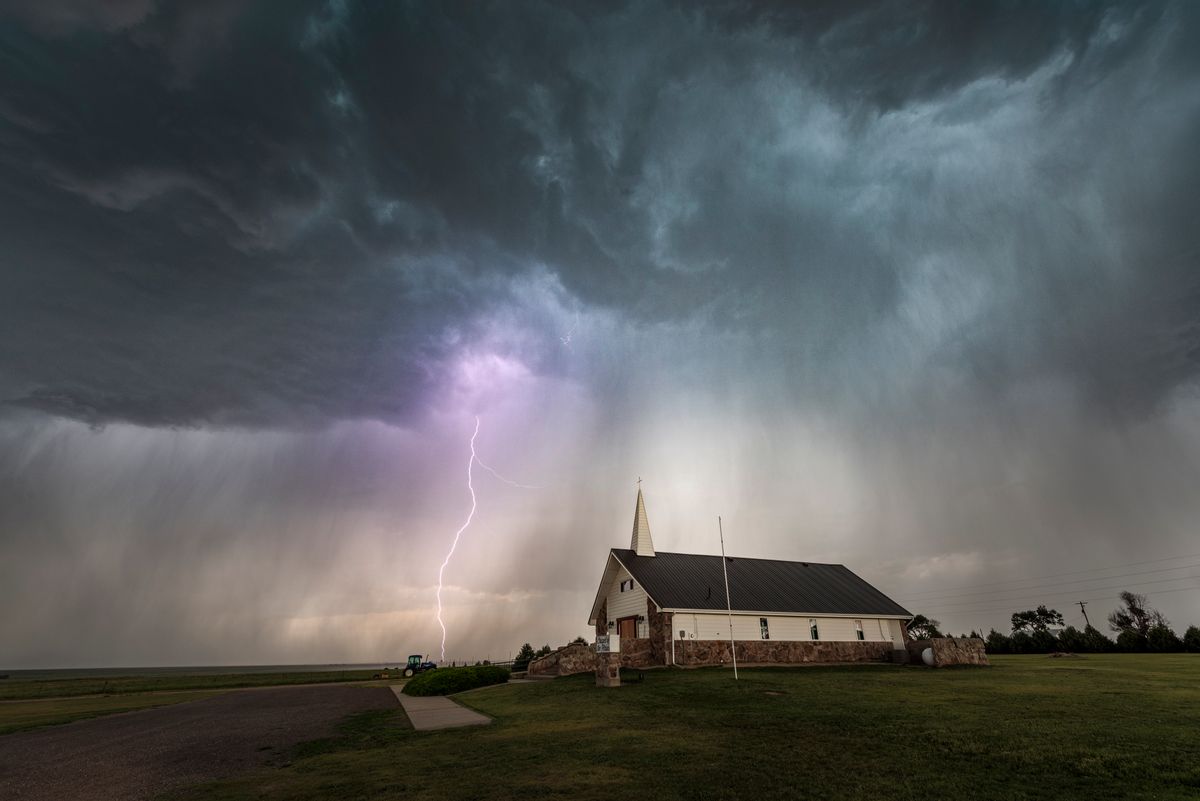 Lightning and Chapel of the Plains. The rain core of this storm was almost right on top of us with the lightning getting closer by the minute, we got out of there just as the rain and hail touched the ground we was stood on. Taken in Stoneham Colorado (Getty Images / john finney photography)