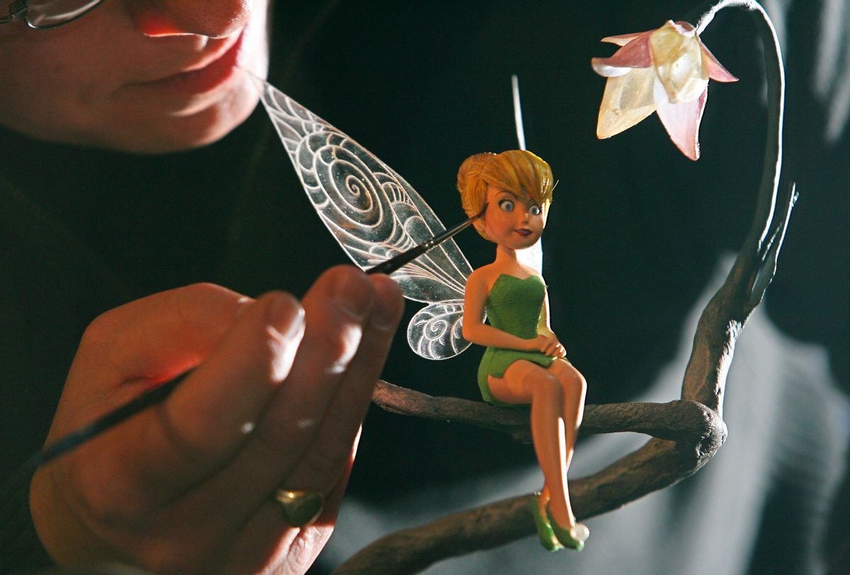 Sculptor Steven Mansfield arranges a waxworks model of fictional fairy character 'Tinker Bell' at Madame Tussauds Museum in London, on November 10, 2008. Standing at only five and a half inches tall, the model of the legendary fairy is the smallest ever created by Madame Tussauds. AFP PHOTO/CARL DE SOUZA    (Photo credit should read CARL DE SOUZA/AFP via Getty Images) ( CARL DE SOUZA/AFP via Getty Images)