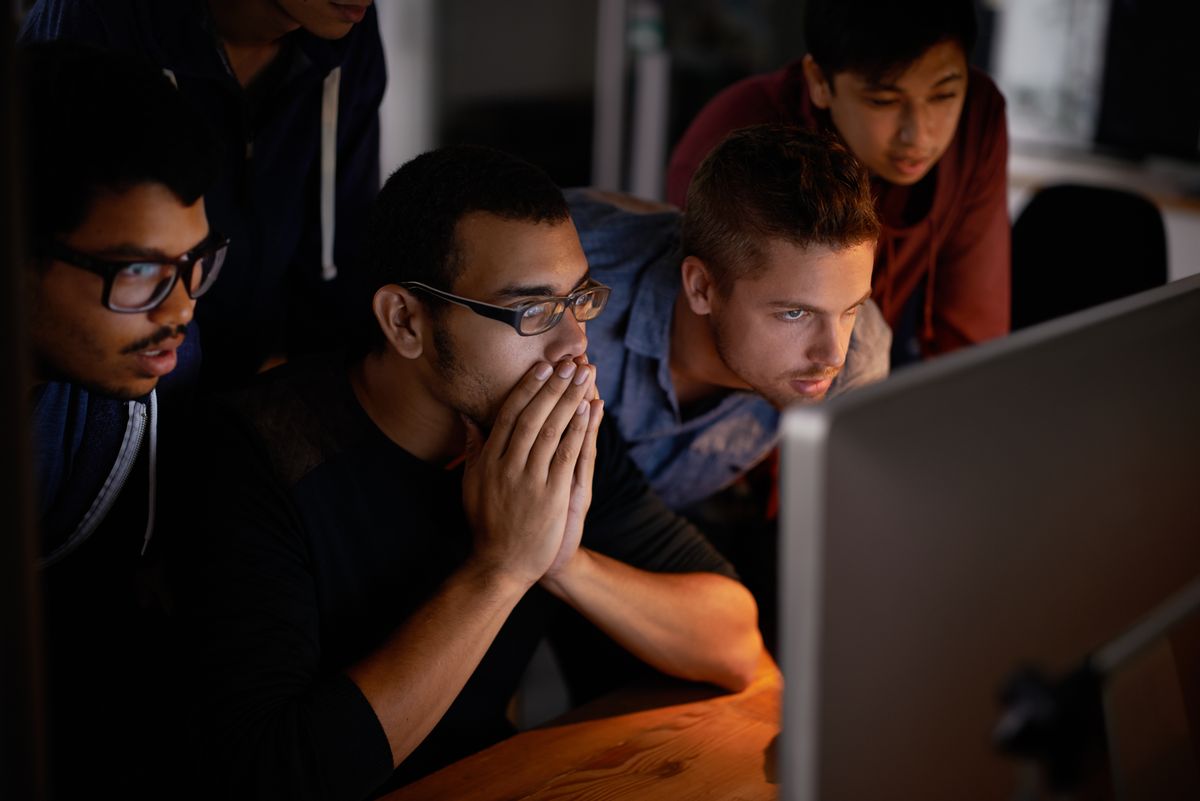 Shot of a group of young designers staring tensely at a monitor. (Getty Images/Yuri_Acurs) (Getty Images/Yuri_Acurs)