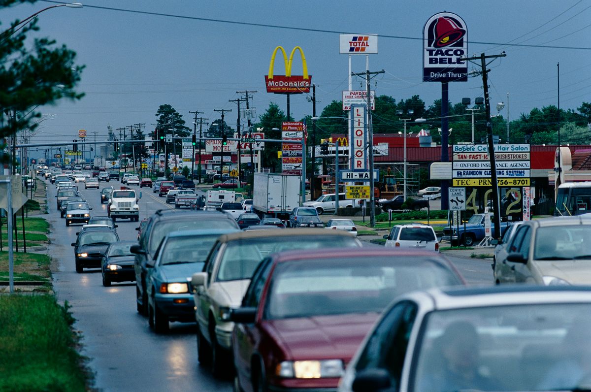 A typical "strip" of highway businesses including signs for McDonalds and Taco Bell fast food restaurants along U.S. Highway 412 in Springdale, a town north of Fayetteville in northeast Arkansas. | Location: Springdale, Arkansas, USA.  (Photo by David Butow/Corbis via Getty Images) (David Butow/Corbis via Getty Images)