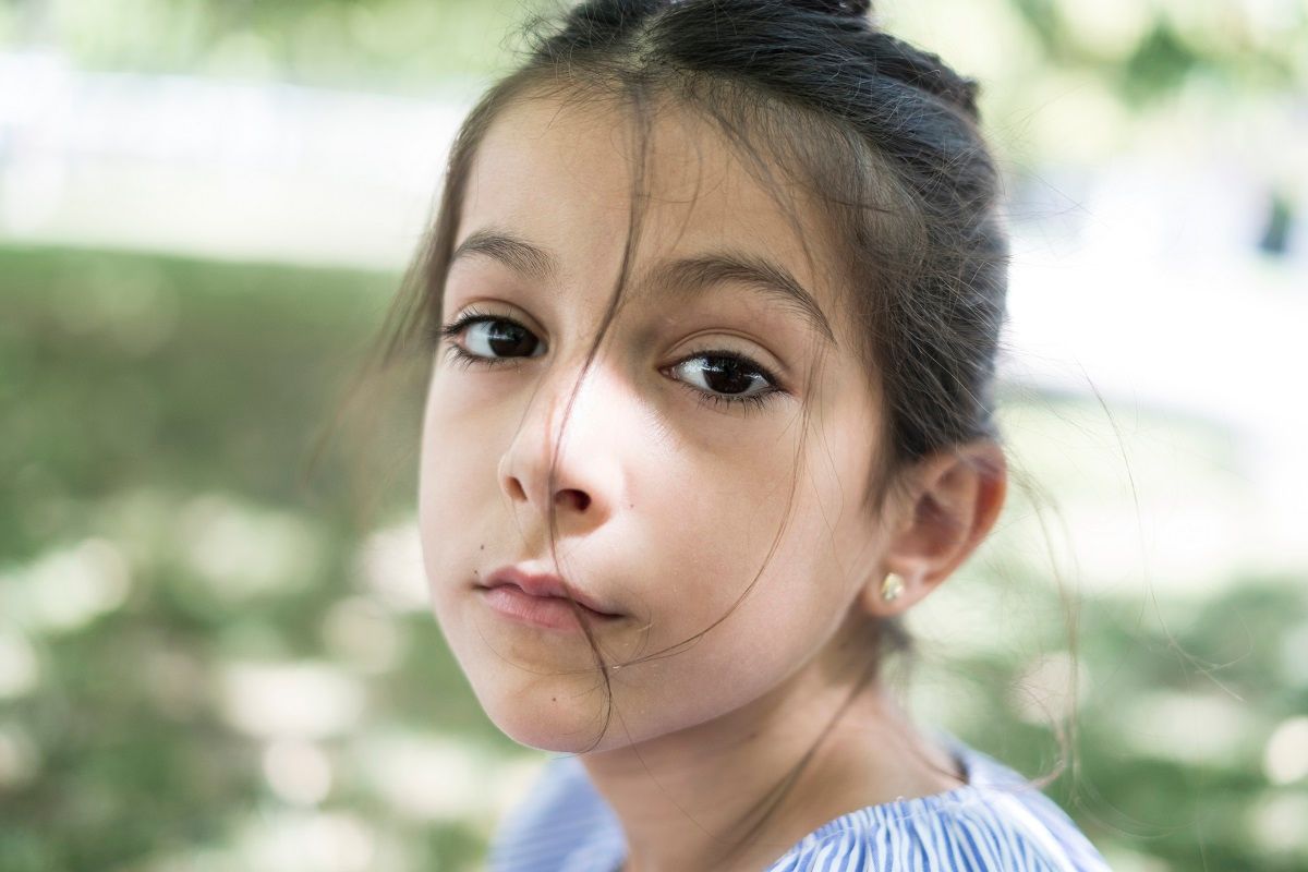 Little 7 years old girl portrait in park (Getty Images /  Antonio Garcia Recena)
