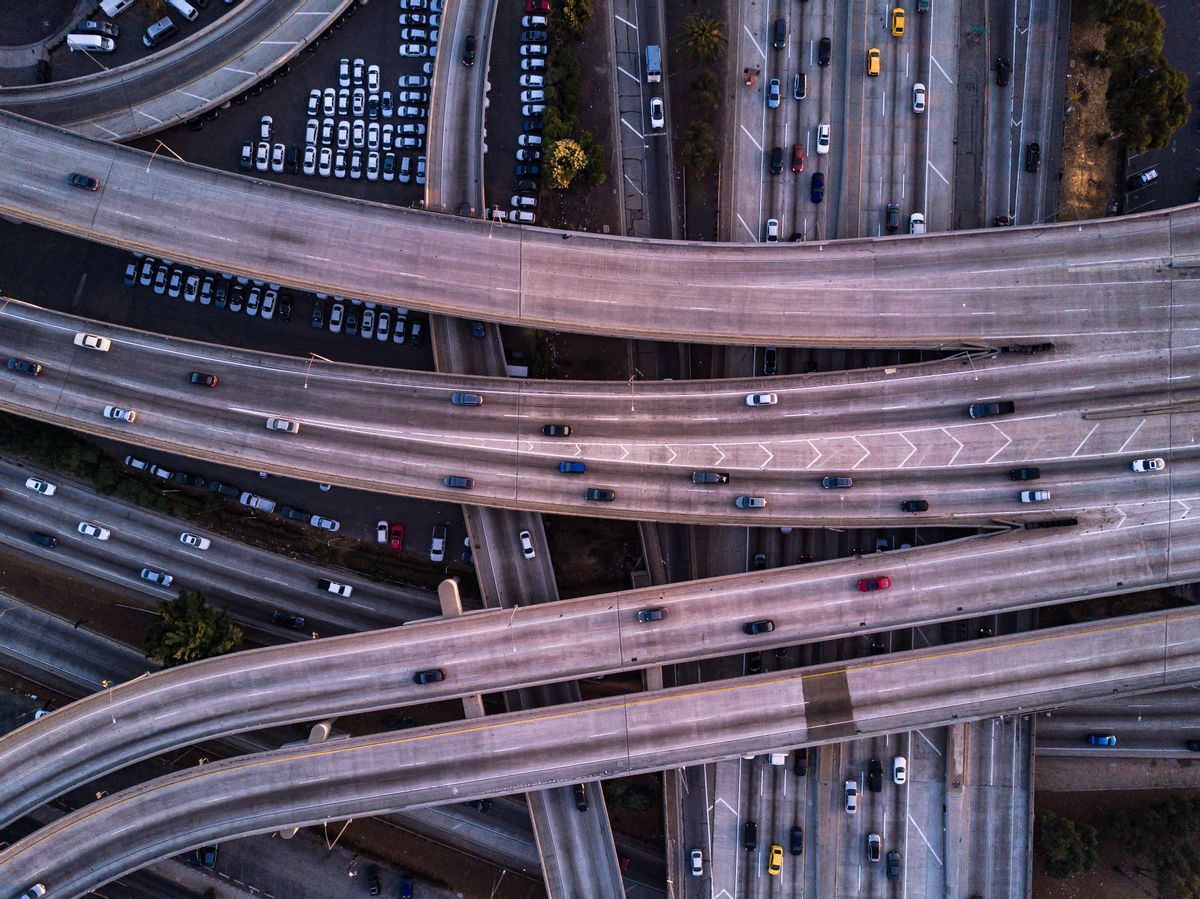 Drone shot of the I-10 / I-110 Interchange on the edge of Downtown Los Angeles at sunset. (halbergman / Getty Images)