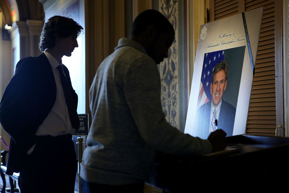 WASHINGTON, DC - SEPTEMBER 14:  Intern Chris Jobson (L) and press assistant Isaiah Calvin (R) of Senate Democratic Media Center sign condolence book for Ambassador J. Christopher Stevens at the U.S. Capitol September 14, 2012 in Washington, DC. Ambassador Stevens and three other Americans were killed in an attack on the U.S. Consulate in Benghazi, Libya on September 11, 2012.  (Photo by Alex Wong/Getty Images) (Alex Wong/Getty Images)
