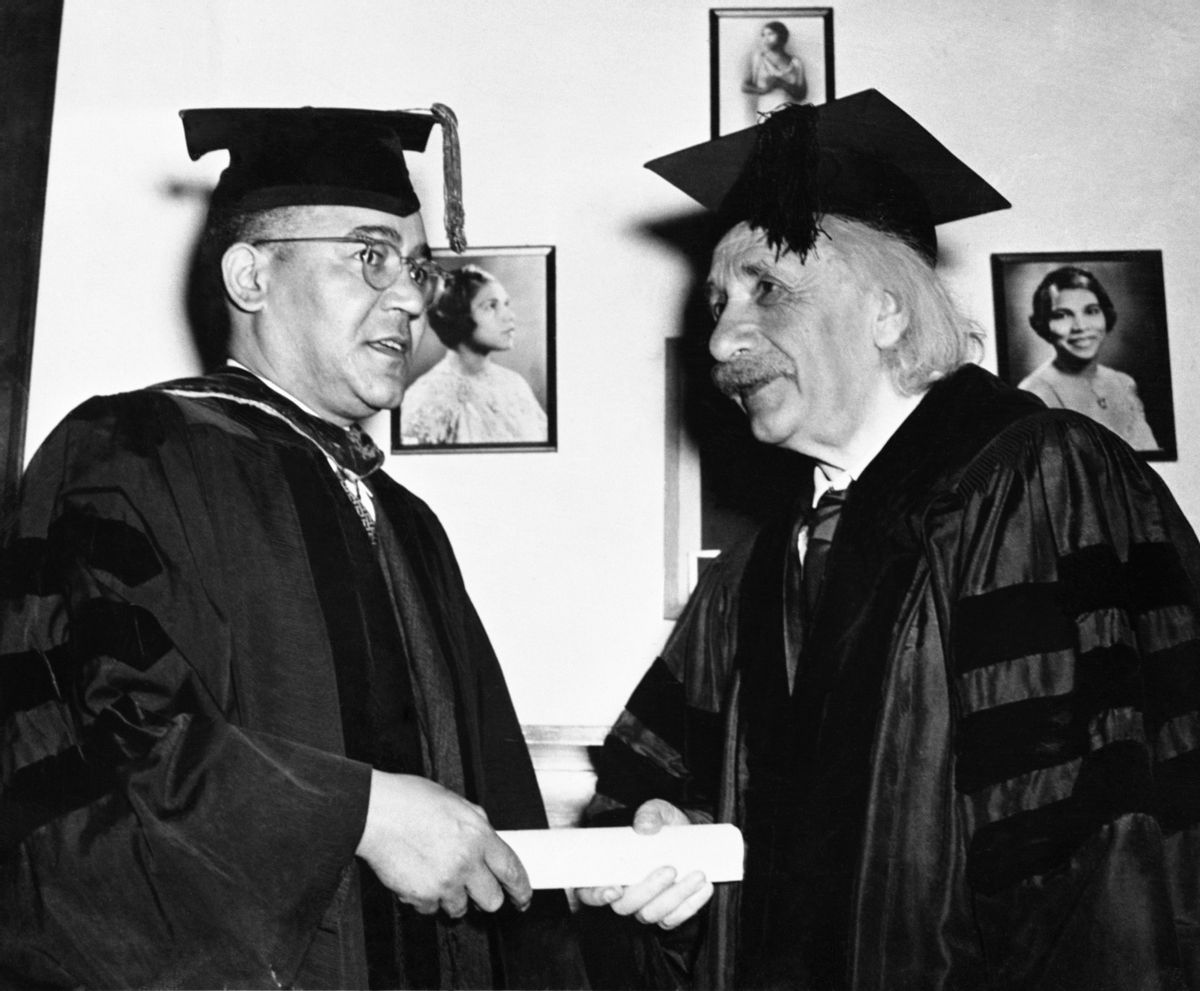 Einstein receives honorary degree from Horace Mann Bond, President of Lincoln University. The photo on wall is singer Marian Anderson. (Bettmann via Getty Images)