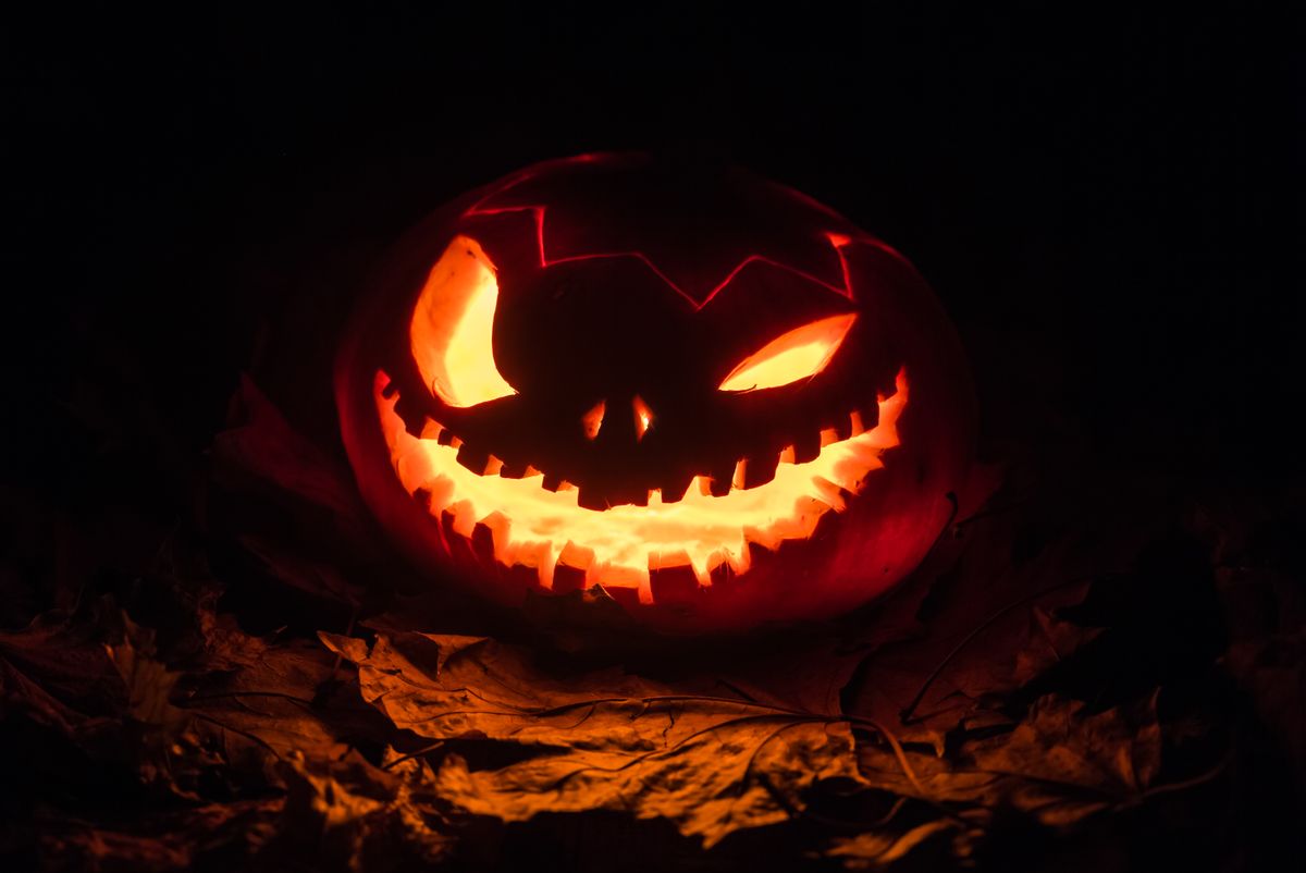 Halloween pumpkins lit by torch (Getty Images/Stock photo)