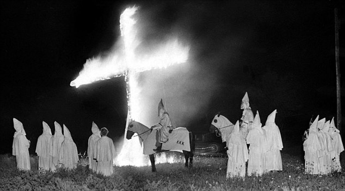 ca. 1965, USA --- Ku Klux Klan Meeting. --- Image by © Hulton-Deutsch Collection/CORBIS (KKK web site)