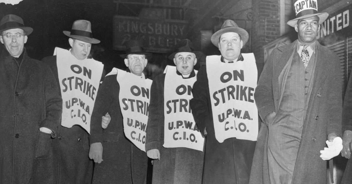 (Original Caption) On the picket line of the United Packing House Workers (CIO) at the Chicago Stockyards early today when the meat strike broke. Left to right: Saul Alinsky; Joe Meegan; Father Ambrose Andrak, St. Michael's Parish; Father Edward Plawinski, of St. John of God's Parish; Sig Wlodraczyk, and captain of the pickets who is unidentified. (Bettman / Getty Images)