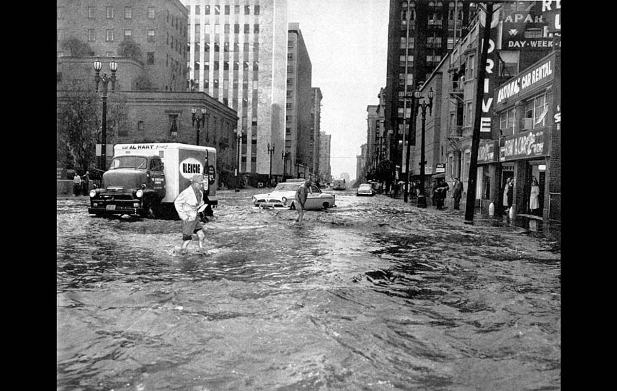 Feb. 19, 1958: Flooding on Flower between 5th and 6th Sts. during storm forces drivers to wade toward sidewalks. The morning storm dumped 2.32 inches of rain before noon.