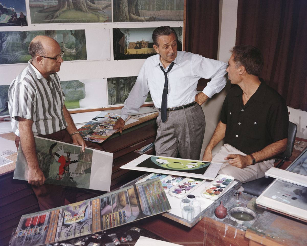 American movie producer, artist, and animator Walt Disney (1901 - 1966) (center) talks with a pair of unidentified animators about some of their work, California, 1950s. (Photo by Gene Lester/Getty Images) (Gene Lester/Getty Images)