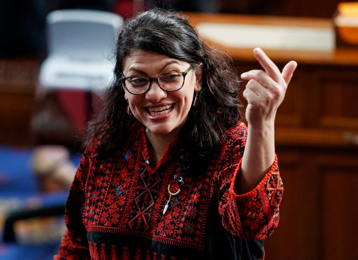 In this Thursday, Jan. 3, 2019 photo, then Rep.-elect Rashida Tlaib of Michigan, is shown on the house floor before being sworn into the 116th Congress at the U.S. Capitol in Washington.  Tlaib exclaimed at an event late Thursday that Democrats were going to “impeach the mother------.” According to video and comments on Twitter, she apparently made the comments during a party hosted by the liberal activist group MoveOn.  (AP Photo/Carolyn Kaster) (AP Photo/Carolyn Kaster)
