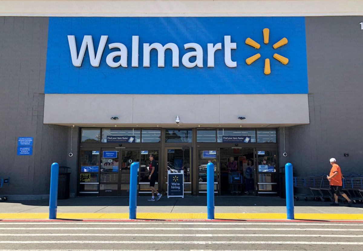 SAN LEANDRO, CALIFORNIA - SEPTEMBER 03: Customers enter a Walmart store on September 03, 2019 in San Leandro, California. Walmart, America's largest retailer, announced that it will reduce the sales of gun ammunition that can be used in handguns and assault style rifles, including .223 caliber and 5.56 caliber bullets. The move comes one month after a gunman opened fire on customers at a Walmart store in El Paso, Texas.  (Photo by Justin Sullivan/Getty Images) (Shutterstock.com)