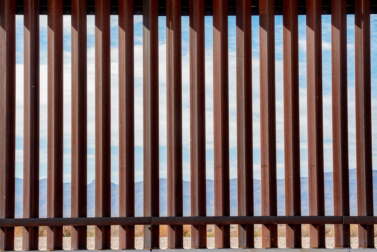 The fence or wall dividing the countries of the USA and Mexico