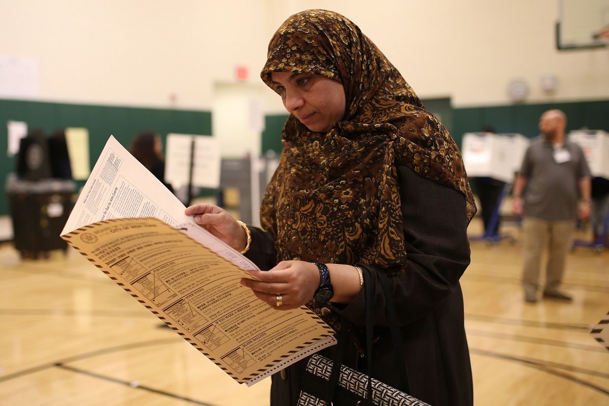BROOKLYN, USA - NOVEMBER 8: A voter looks through the ballot paper after she arrived at Mary White Ovington polling station to cast her ballot during the 2016 Presidential Elections, in Bay Ridge, Brooklyn of New York City, United States on November 8, 2016.
 (Photo by Mohammed Elshamy/Anadolu Agency/Getty Images) (Getty Images)