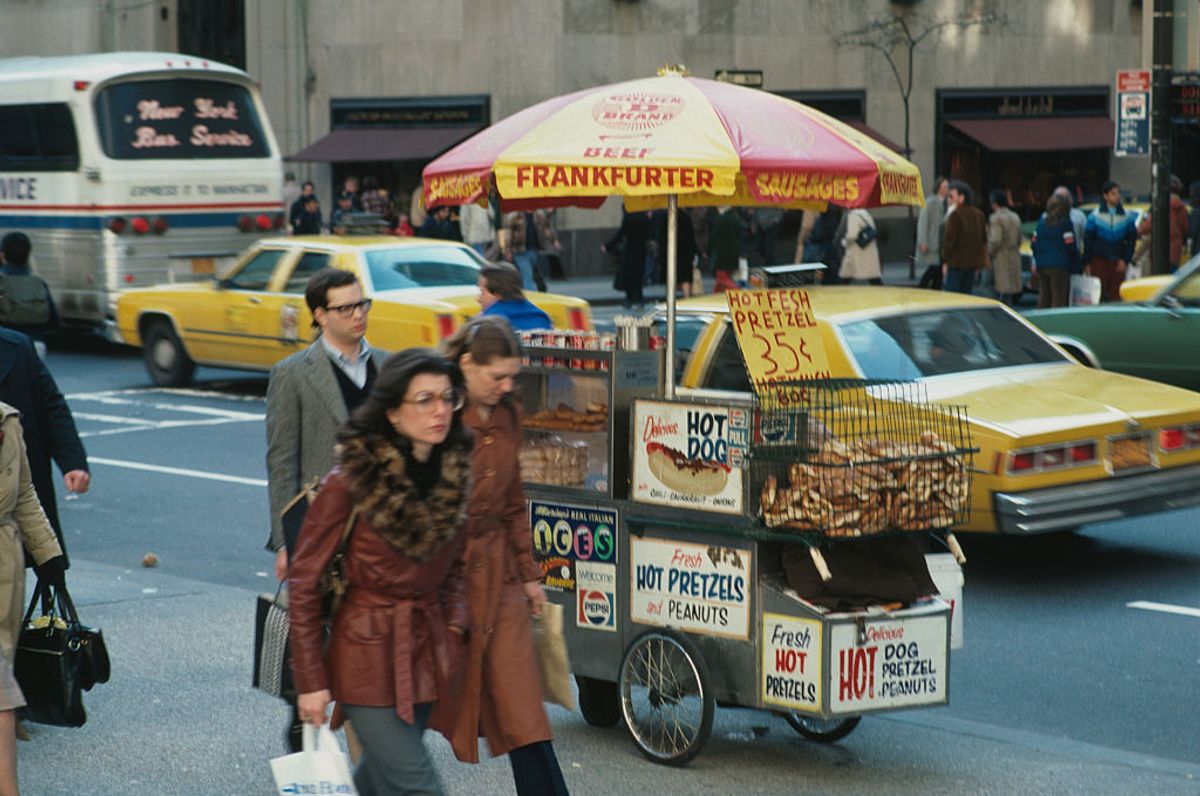 A man selling hot dogs and pretzels from a cart, New York City, USA, April 1980.  (Photo by Barbara Alper/Getty Images) (Getty Images)
