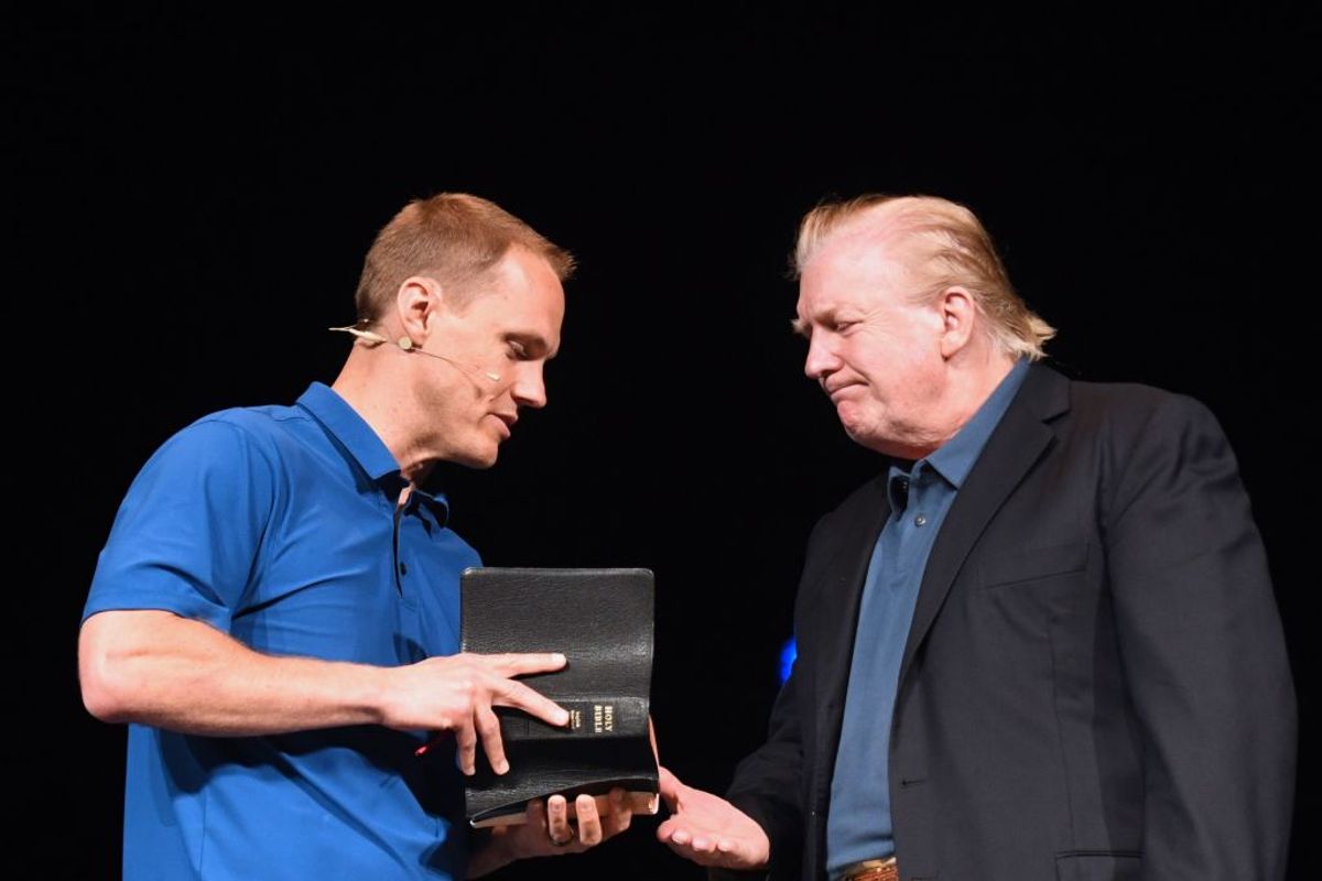 US President Donald Trump shakes hands with Pastor David Platt as he visits McLean Bible Church in Vienna, Virginia on June 2, 2019, to pray for the victims and community of Virginia Beach. - Police in Virginia searched for the reason why a city engineer fired indiscriminately on his workplace colleagues, turning a municipal building into a war zone as he killed at least 12 people and wounded four before being fatally shot himself on May 31, 2019. (Photo by Jim WATSON / AFP)        (Photo credit should read JIM WATSON/AFP/Getty Images) (Getty Images)