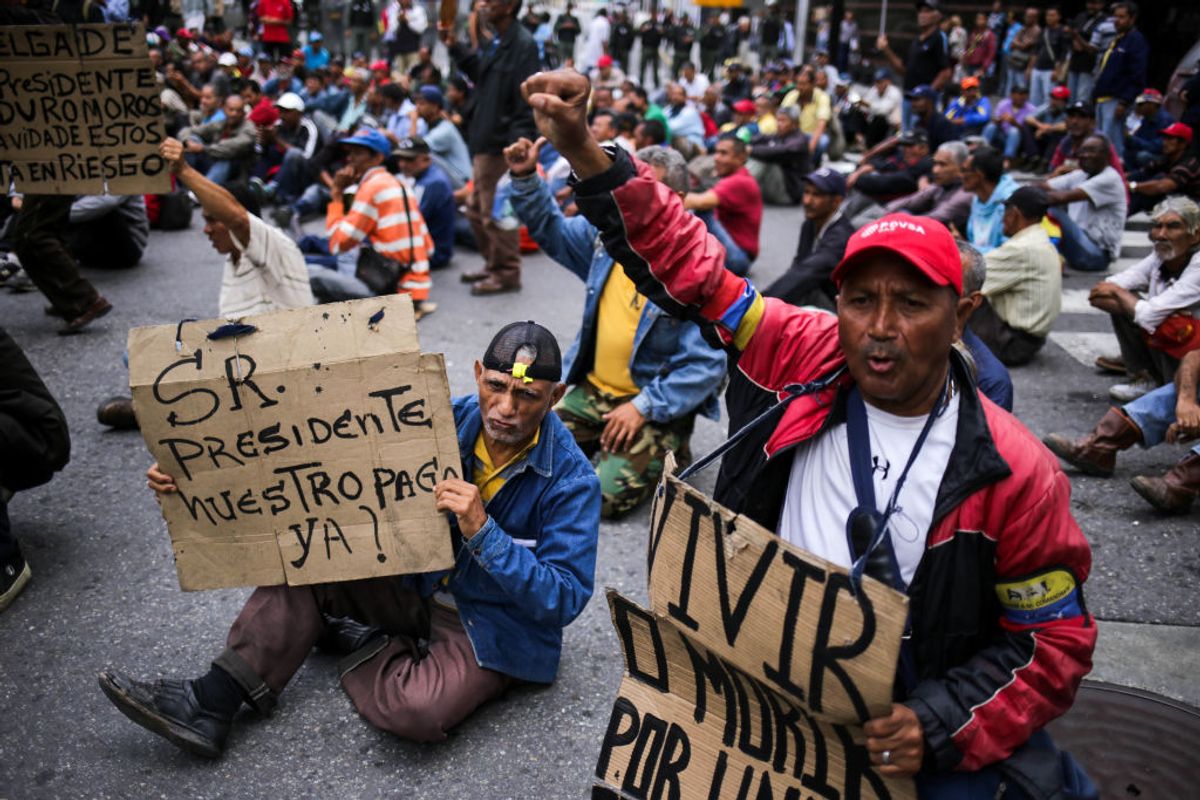 Former workers of the oil sector, some of who are holding a hunger strike since May 30 of unpaid labour liabilities, demonstrate demanding a meeting with visiting United Nations High Commissioner for Human Rights, Chilean Michelle Bachelet, in Caracas on June 20, 2019. - Bachelet arrived in Venezuela Wednesday as part of a visit to review the country's ongoing economic and political crisis. (Photo by Cristian HERNANDEZ / AFP)        (Photo credit should read CRISTIAN HERNANDEZ/AFP/Getty Images)