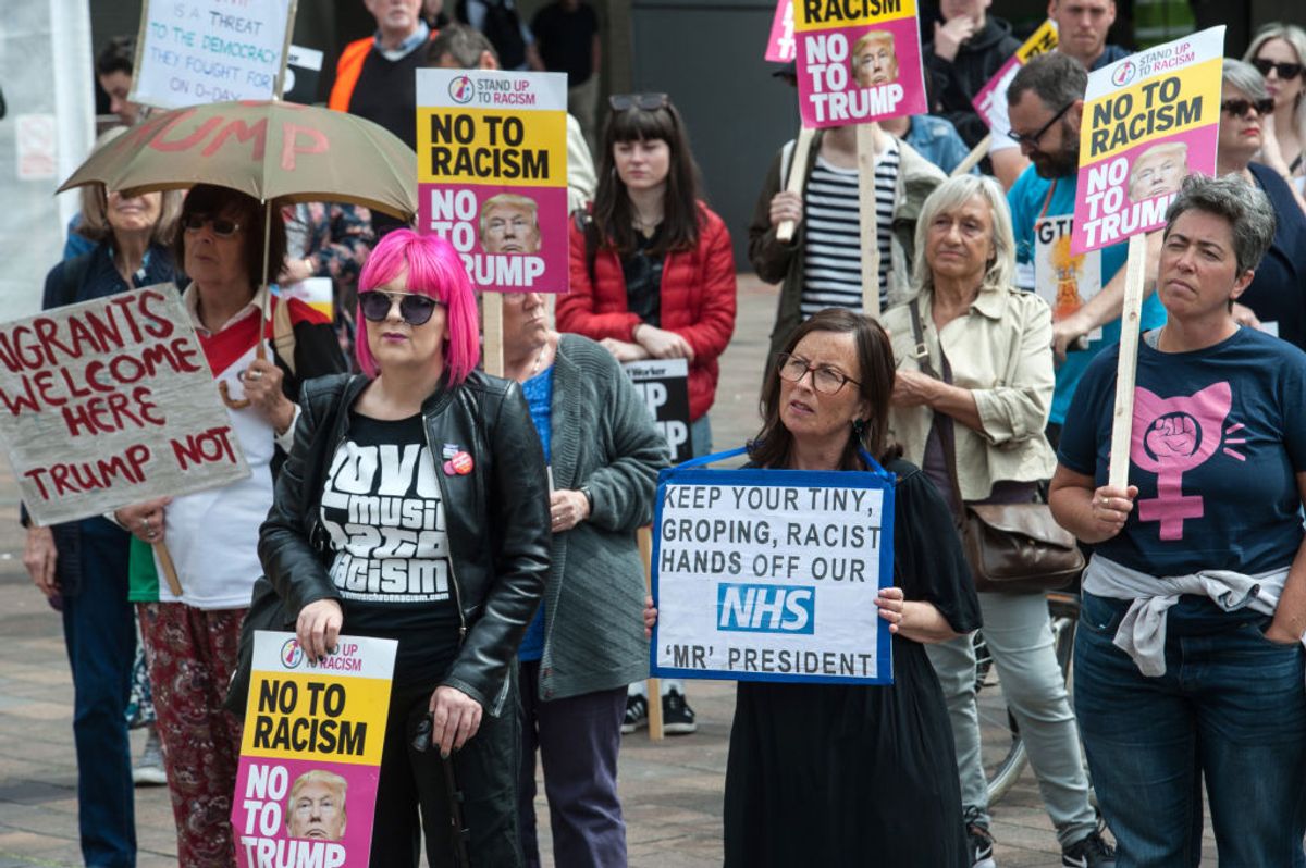 PORTSMOUTH, ENGLAND - JUNE 5: Protesters hold anti-Donald Trump signs in Guildhall Square on June 5, 2019 in Portsmouth, England. Activist groups under the banner Together Against Racism gather in Guildhall Square to demonstrate against the invitation of US President Donald Trump to the local D-Day commemoration. (Photo by Guy Smallman/Getty Images) (Getty Images)