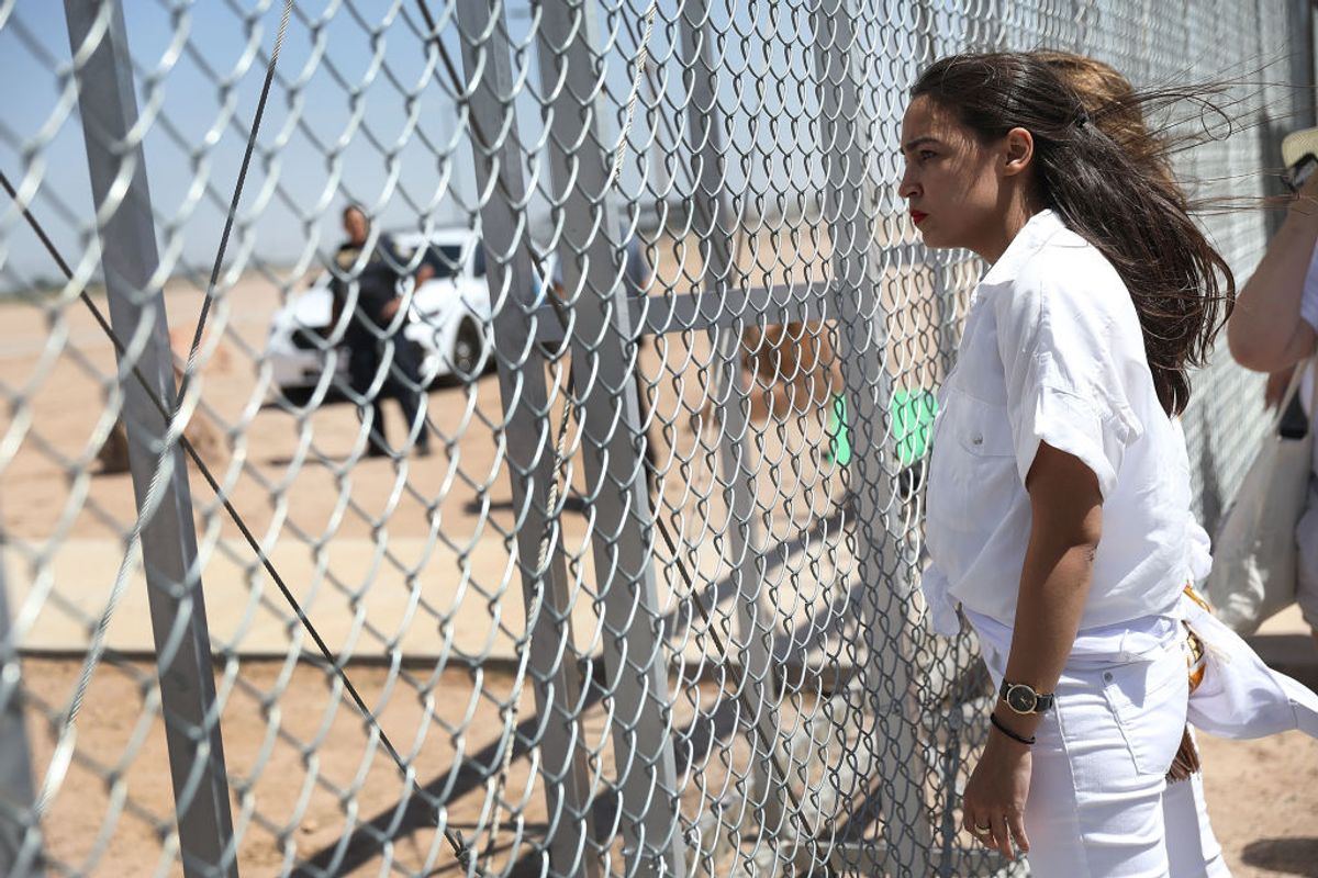TORNILLO, TX - JUNE 24:  Alexandria Ocasio-Cortez stands at the Tornillo-Guadalupe port of entry gate on June 24, 2018 in Tornillo, Texas. She is part of a group protesting the separation of children from their parents after they were caught entering the U.S. under the administration's zero tolerance policy.  (Photo by Joe Raedle/Getty Images) (Getty Images)