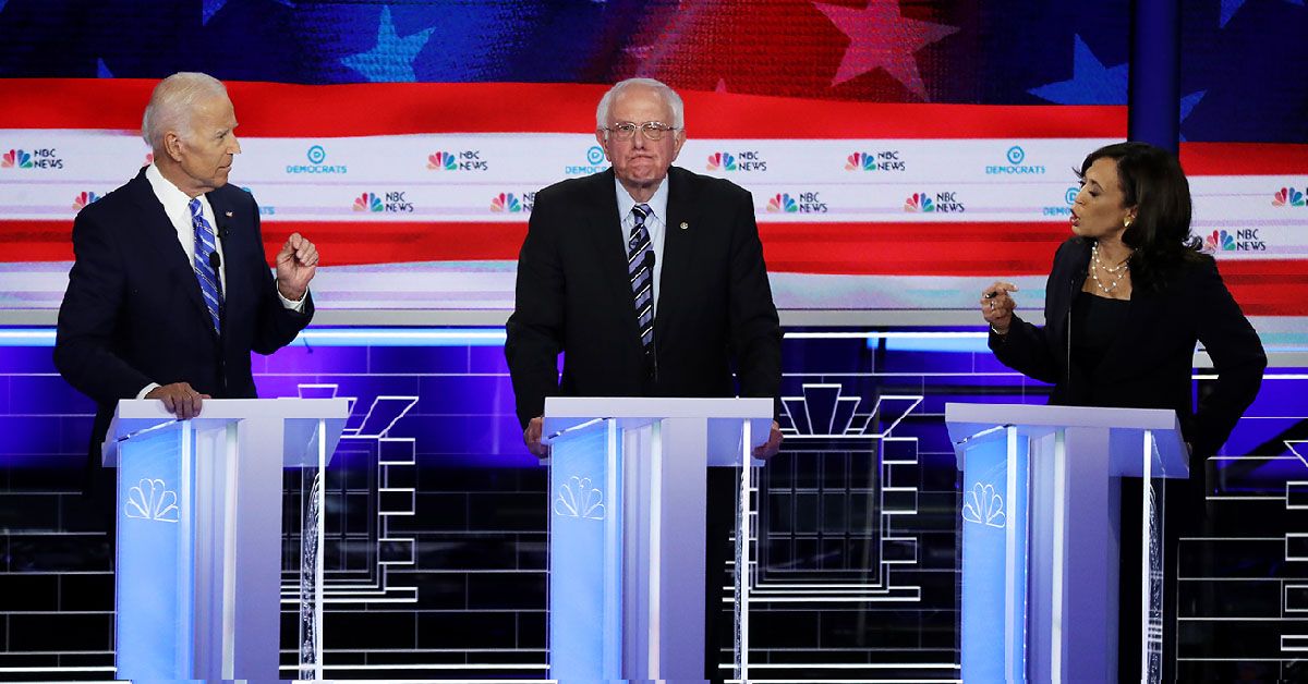 MIAMI, FLORIDA - JUNE 27: Sen. Kamala Harris (R) (D-CA) and former Vice President Joe Biden (L) speak as Sen. Bernie Sanders (I-VT) looks on during the second night of the first Democratic presidential debate on June 27, 2019 in Miami, Florida. A field of 20 Democratic presidential candidates was split into two groups of 10 for the first debate of the 2020 election, taking place over two nights at Knight Concert Hall of the Adrienne Arsht Center for the Performing Arts of Miami-Dade County, hosted by NBC News, MSNBC, and Telemundo. (Photo by Drew Angerer/Getty Images) (Drew Angerer/Getty Images)