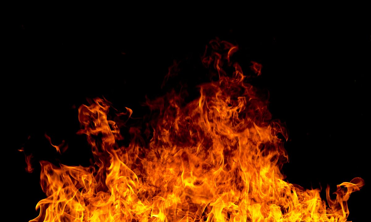 Firestorm texture on black background, shot of flying fire sparks (Getty Images)