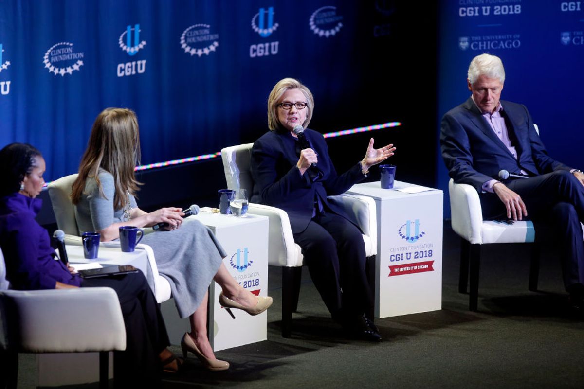 CHICAGO, IL - OCTOBER 20: Moderator Helene Gayle (L), Chelsea Clinton, and former President Bill Clinton, listen as former Secretary of State Hillary Clinton speaks during the annual Clinton Global Initiative conference at the University of Chicago on October 16, 2018 in Chicago, Illinois. The Clintons addressed the next generation of leaders of and global warming. (Photo by Joshua Lott/Getty Images) (Brian A Jackson / Shutterstock.com)