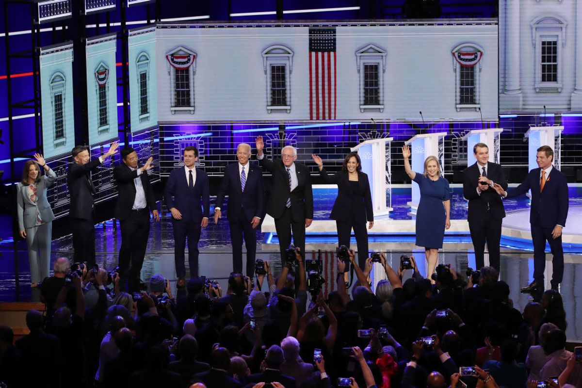 MIAMI, FLORIDA - JUNE 27: Democratic presidential candidates (L-R) Marianne Williamson, former Colorado governor John Hickenlooper, former tech executive Andrew Yang, South Bend, Indiana Mayor Pete Buttigieg, former Vice President Joe Biden, Sen. Bernie Sanders (I-VT), Sen. Kamala Harris (D-CA), Sen. Kirsten Gillibrand (D-NY), Sen. Michael Bennet (D-CO), and Rep. Eric Swalwell (D-CA) take the stage for the second night of the first Democratic presidential debate on June 27, 2019 in Miami, Florida.  A field of 20 Democratic presidential candidates was split into two groups of 10 for the first debate of the 2020 election, taking place over two nights at Knight Concert Hall of the Adrienne Arsht Center for the Performing Arts of Miami-Dade County, hosted by NBC News, MSNBC, and Telemundo. (Photo by Drew Angerer/Getty Images) (Getty Images)