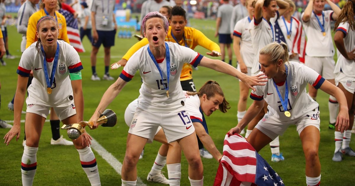 LYON, FRANCE - JULY 07: Megan Rapinoe of the USA celebrates victory with the FIFA Women's World Cup Trophy and teammates following the 2019 FIFA Women's World Cup France Final match between The United States of America and The Netherlands at Stade de Lyon on July 07, 2019 in Lyon, France. (Photo by Richard Heathcote/Getty Images) (Getty Images)