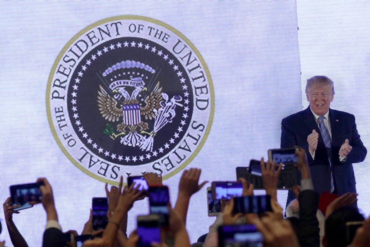 WASHINGTON, DC - JULY 23:  U.S. President Donald Trump applauds in front of a doctored presidential seal with a double headed eagle and a set of golf clubs as he arrives to address the Teen Student Action Summit July 23, 2019 in Washington, DC. Conservative high school students gathered for the 4-day invited-only conference hosted by Turning Point USA to hear from conservative leaders and activists, receive activism and leadership training, and network with other attendees and organizations from across the U.S. (Photo by Alex Wong/Getty Images) (Getty Images)