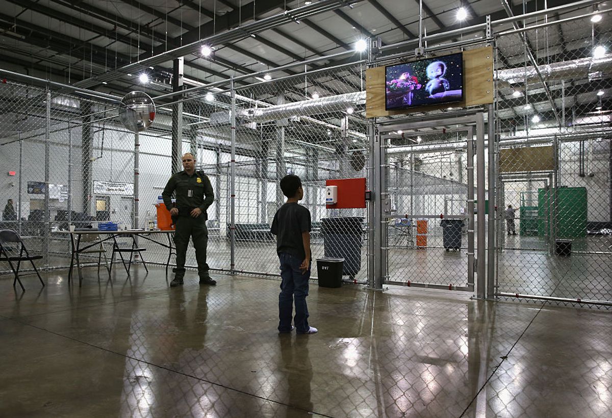 MCALLEN, TX - SEPTEMBER 08:  A boy from Honduras watches a movie at a detention facility run by the U.S. Border Patrol on September 8, 2014 in McAllen, Texas. The Border Patrol opened the holding center to temporarily house the children after tens of thousands of families and unaccompanied minors from Central America crossed the border illegally into the United States during the spring and summer. Although the flow of underage immigrants has since slowed greatly, thousands of them are now housed in centers around the United States as immigration courts process their cases. (Photo by John Moore/Getty Images) (Getty Images)