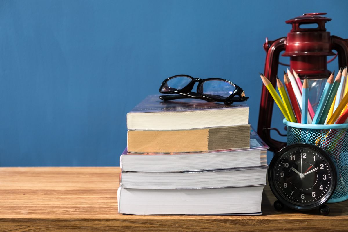 Education concept,School books on desk,idea concept, pencil,Lantern (Getty Images)