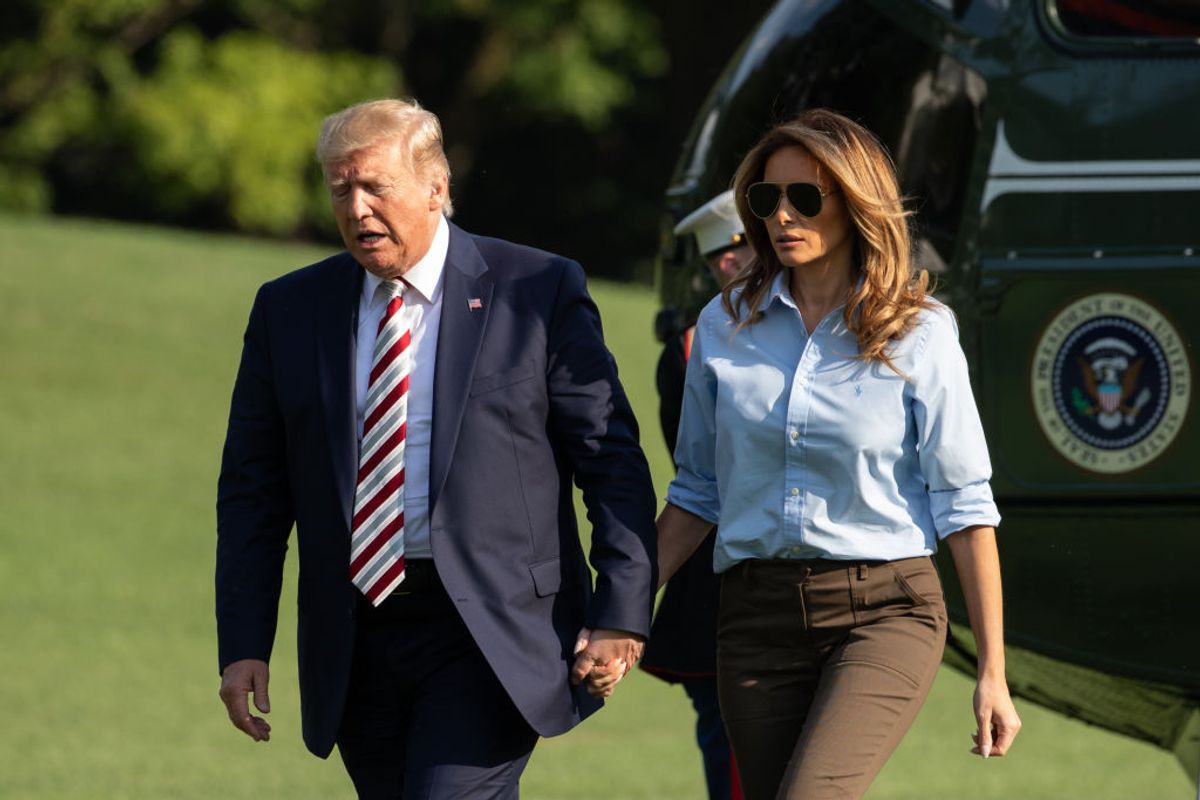 U.S. President Donald Trump and First Lady Melania Trump walk on the South Lawn of the White House after arriving on Marine One in Washington, DC., on Sunday, August 4, 2019.  (Photo by Cheriss May/NurPhoto via Getty Images) (Getty Images)
