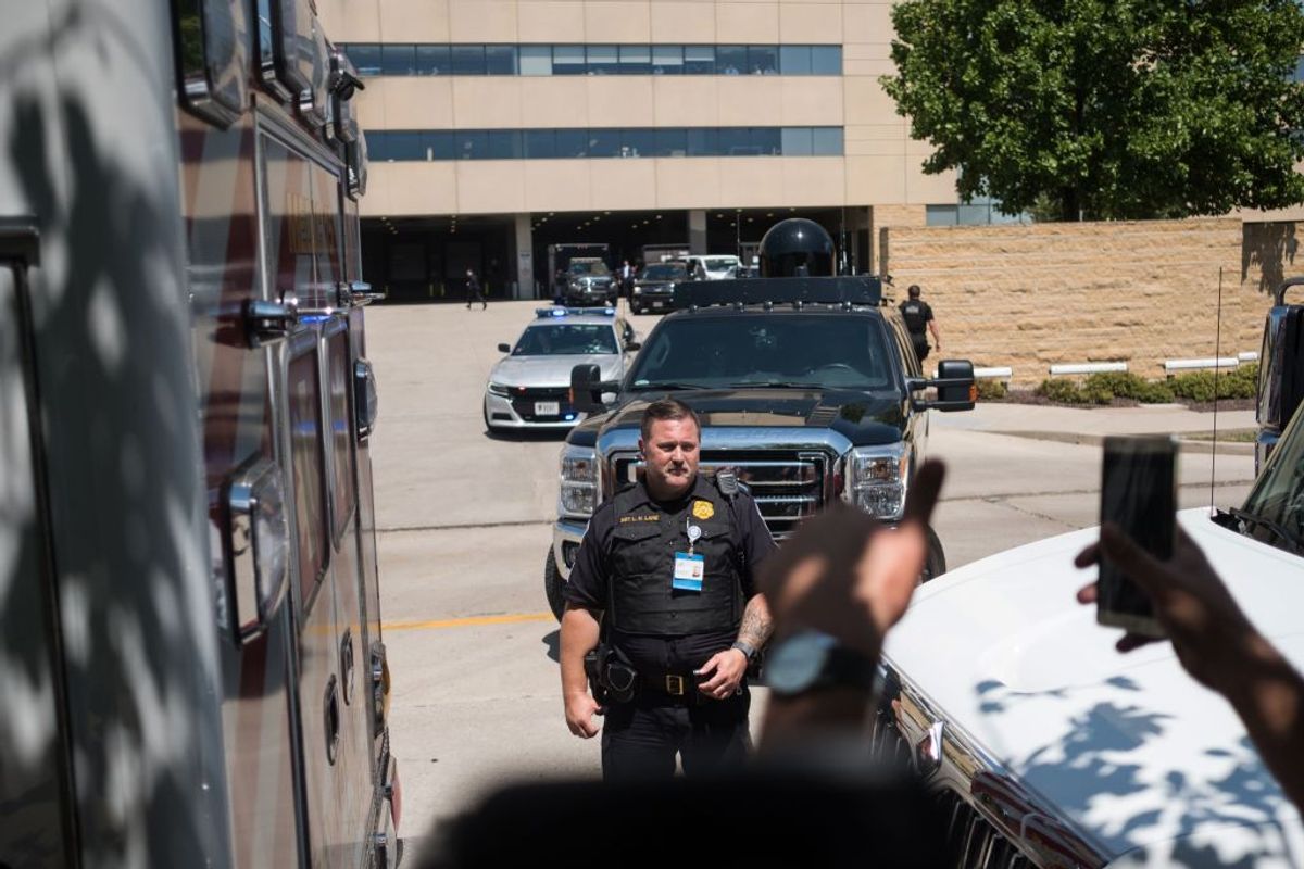 Police officers and Secret Service agents are seen at Miami Valley Hospital where US President Donald Trump made a visit after the mass shooting in Dayton, Ohio, on August 7, 2019. - Nine people were killed on August 4 in the city's popular Oregon District. (Photo by Megan JELINGER / AFP)        (Photo credit should read MEGAN JELINGER/AFP/Getty Images) (Getty Images)