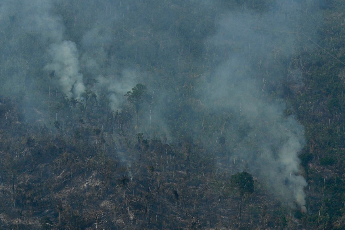 Fire consumes an area near Jaci Parana, state of Rondonia, Brazil, Saturday, Aug. 24, 2019. Brazil says military aircraft and 44,000 troops will be available to fight fires sweeping through parts of the Amazon region. The defense and environment ministers have outlined plans to battle the blazes that have prompted an international outcry as well as demonstrations in Brazil against President Jair Bolsonaro's handling of the environmental crisis. (AP Photo/Eraldo Peres) (AP Photo/Eraldo Peres)