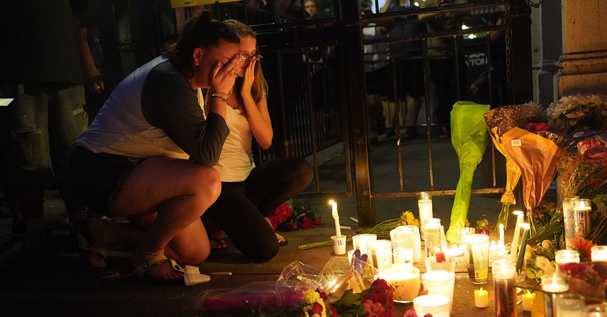 DAYTON, Aug. 5, 2019 -- People attend a vigil held to mourn for victims in front of the bar where shooting occurred in Dayton of Ohio, the United States, on Aug. 4, 2019. Nine people were killed with 26 others injured in a mass shooting on Aug. 4 near a bar in Dayton, a city in midwest U.S. state of Ohio, the authorities said. (Photo by Liu Jie/Xinhua via Getty) (Xinhua/Liu Jie via Getty Images) (Xinhua/Liu Jie/Getty Images)