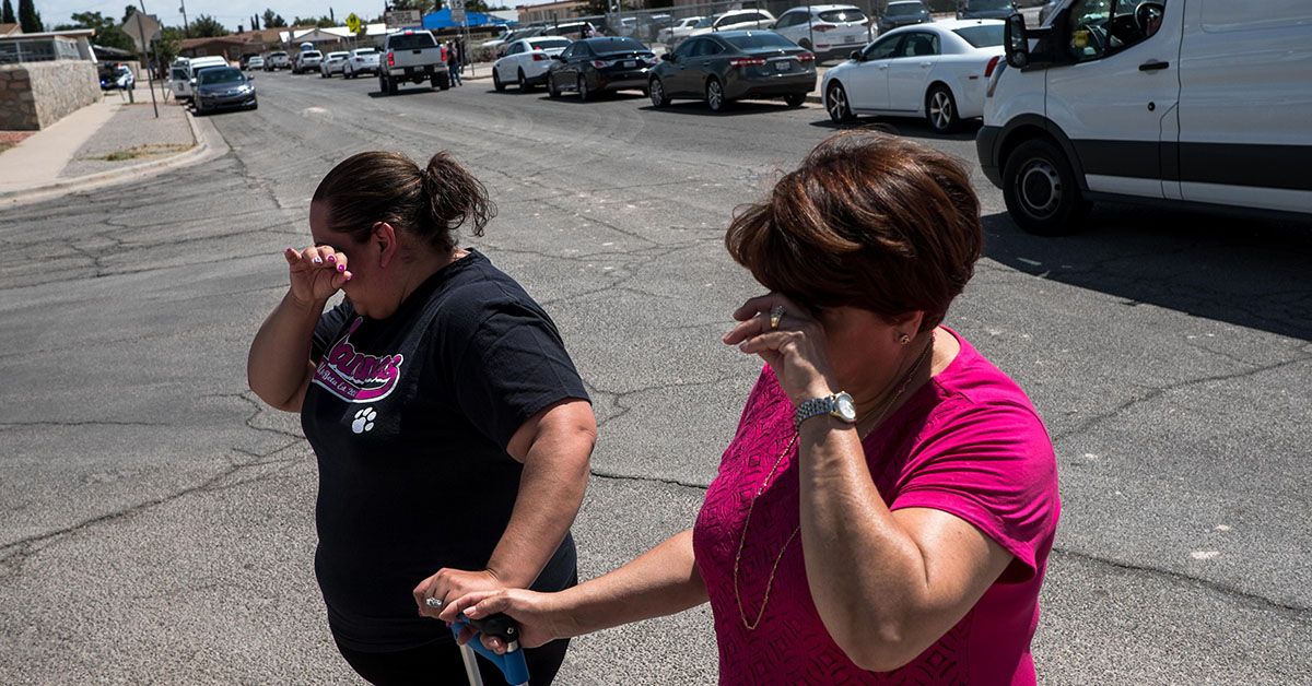 Residents Erica Rios, 36, and Alma Rios, 61, cry outside a reunification center at MacArthur Elementary School, following a deadly mass shooting, in El Paso, Texas, on August 3, 2019. - A gunman armed with an assault rifle killed 20 people Saturday when he opened fire on shoppers at a packed Walmart store in the latest mass shooting in the United States. (Photo by Joel Angel JUAREZ / AFP) (JOEL ANGEL JUAREZ/AFP/Getty Images)