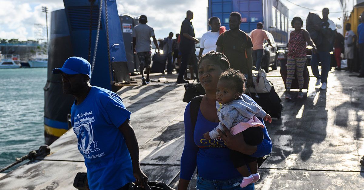 Evacuees get off a ferry after leaving Marsh Harbour on Abaco island in the aftermath of hurricane Dorian in Nassau, Bahamas on September 9, 2019. - President Donald Trump said Monday that the US would have to be careful about allowing Bahamian survivors of Hurricane Dorian into the country, warning there could be "very bad people" among them. The previous day, several hundred storm survivors were prevented from boarding a ferry from the Bahamas to Florida because they lacked US visas -- an incident that a top American immigration official said was a mistake. (Photo by ANDREW CABALLERO-REYNOLDS / AFP) (Photo credit should read ANDREW CABALLERO-REYNOLDS/AFP/Getty Images) (ANDREW CABALLERO-REYNOLDS/AFP/Getty Images)