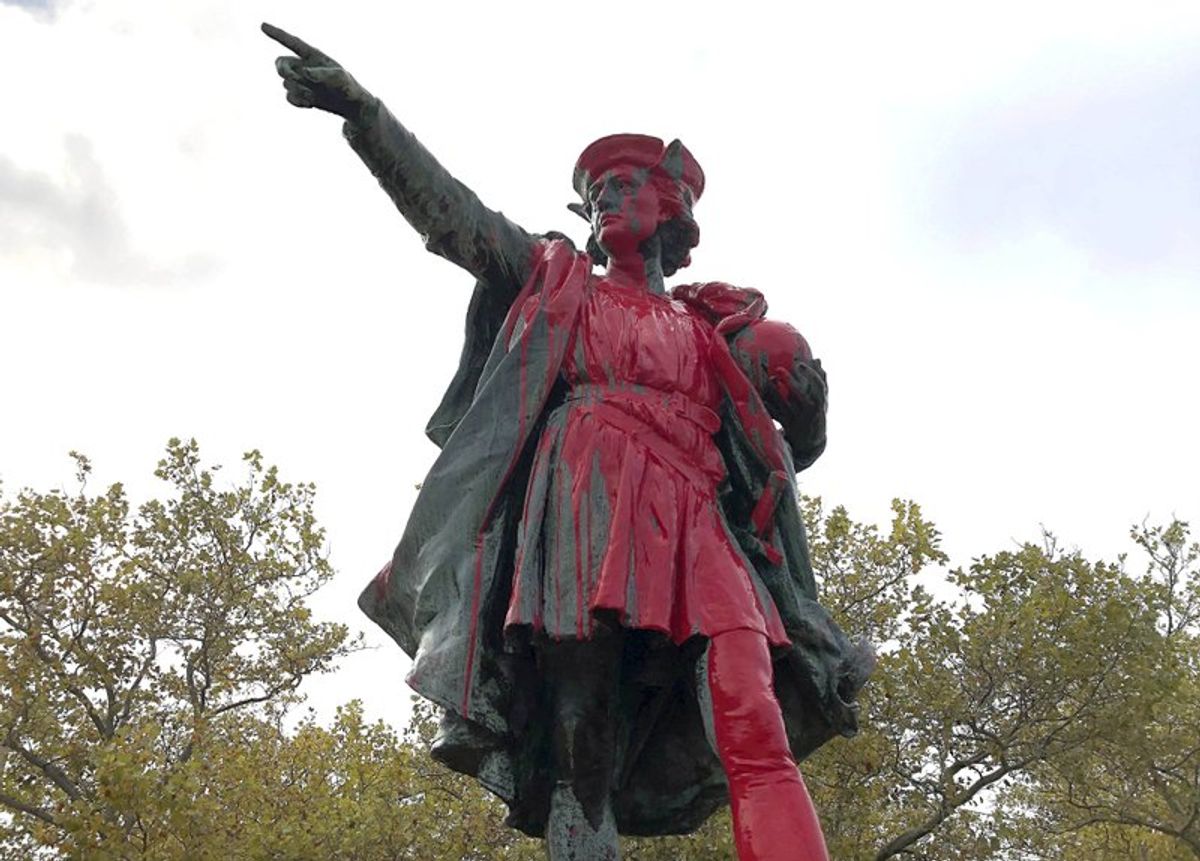 Red paint covers a statue of Christopher Columbus on Monday, Oct. 14, 2019, in Providence, R.I., after it was vandalized on the day named to honor him as one of the first Europeans to reach the New World. The statue has been the target of vandals on Columbus Day in the past. (AP Photo/Michelle R. Smith) (AP Photo/Michelle R. Smith)