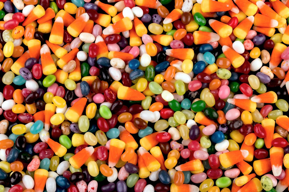 Overhead closeup of a bunch of jelly beans and candy corn randomly spread out across the entire frame (Getty Images, stock)
