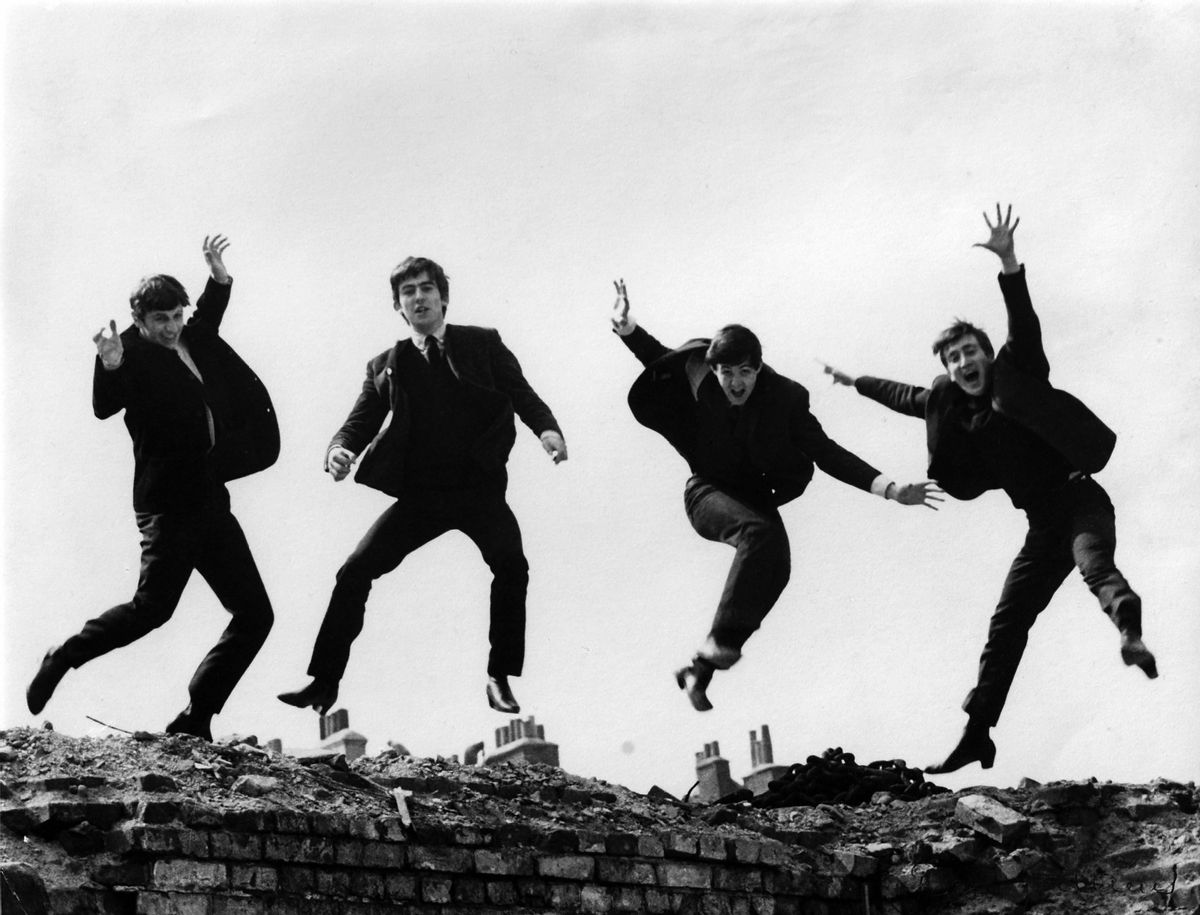 UNITED KINGDOM - APRIL 01:  Photo of BEATLES; L-R: Ringo Starr, George Harrison, Paul McCartney, John Lennon - posed, group shot - jumping on wall, Used on the Twist &amp; Shout EP cover  (Photo by Fiona Adams/Redferns) (Fiona Adams/Redferns)
