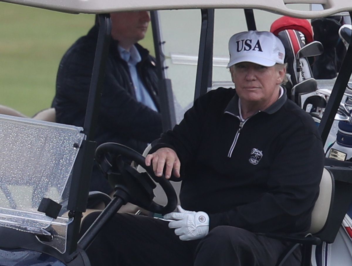 US President Donald Trump drives a golf buggy on his golf course at the Trump Turnberry resort in South Ayrshire, where he and his wife Melania, spent the weekend as part of their visit to the UK before leaving for Finland where he will meet Russian leader Vladimir Putin for talks on Monday. (Photo by Andrew Milligan/PA Images via Getty Images) ( Leon Neal/Getty Images)