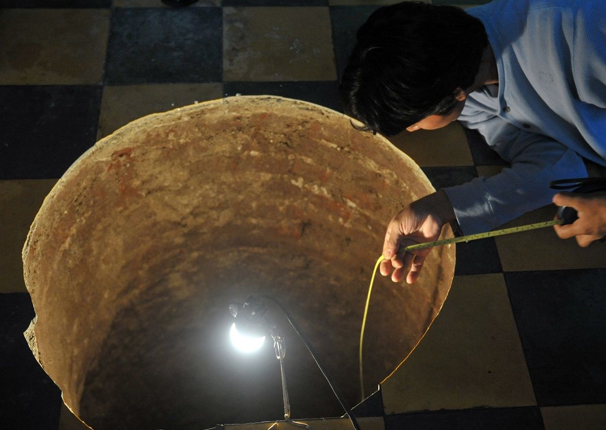 A man inspects a sinkhole inside  a house on July 19, 2011 north of Guatemala City.  When neighbors heard the loud boom overnight they thought a cooking gas canister had detonated. Instead they found a deep sinkhole the size of a large pot inside a home in a neighborhood just north of Guatemala City.  The sinkhole was 12.2 meters (40 feet) deep and 80 centimeters (32 inches) in diameter, an AFP journalist who visited the site reported.  Police, members of the country's natural disaster office and water utility company officials came to visit the site.  Sinkholes, formed by the natural process of erosion, can be gradual but are often sudden.
Guatemala City, built on volcanic deposits, is especially prone to sinkholes, often blamed on a leaky sewer system or on heavy rain.   AFP PHOTO / Johan ORDONEZ (Photo credit should read JOHAN ORDONEZ/AFP/Getty Images) (Getty Images)