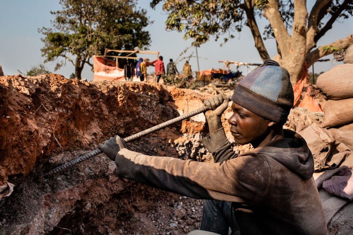 KOLWEZI, DRC: A young miner digs for cobalt inside the CDM (Congo DongFang International Mining) Kasulo mine. "n"nCobalt is a vital mineral needed for the production of rechargeable batteries. Two thirds of the world supply is located in southern DRC where men, women and children all work. Efforts are being made to stop child labor in the cobalt mines, but they have not been successful."n"nBatteries needed for phones, computers and electric cars have pushed the global demand for cobalt through the roof. Chinese companies and middlemen have the strongest hold on the market. Tech companies like Apple, Microsoft and Tesla are trying to find a way to access Congolese cobalt in a more humane way with proper accountability. (Getty Images)