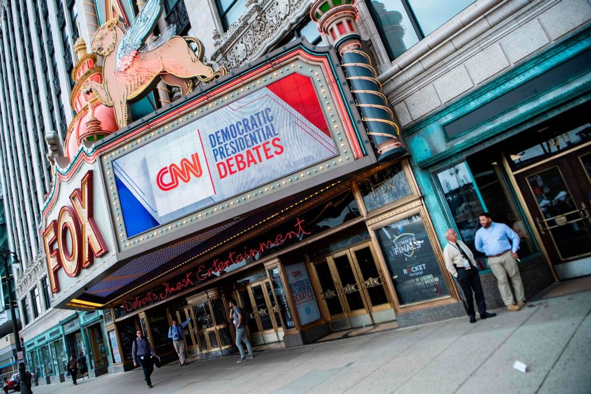 People stand outside the Fox Theatre ahead of the democratic debates in Detroit, Michigan on July 29, 2019. - Democrat presidential candidates will debate in Detroit on July 30-31. (Photo by JIM WATSON / AFP)        (Photo credit should read JIM WATSON/AFP via Getty Images) (Getty Images)