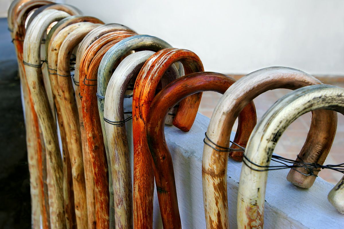 locally made bent cane walking sticks for sale on village wall, Crete. (Getty Images/Stock photo)